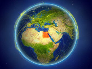 Egypt from space on planet Earth with digital network representing international communication, technology and travel.