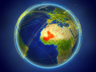 Mali from space on planet Earth with digital network representing international communication, technology and travel.
