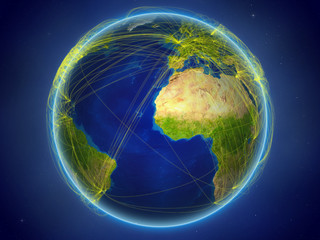 Gambia from space on planet Earth with digital network representing international communication, technology and travel.