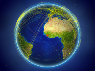 Sierra Leone from space on planet Earth with digital network representing international communication, technology and travel.