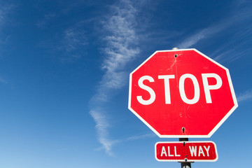 stop sign against blue sky