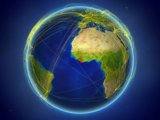 Liberia from space on planet Earth with digital network representing international communication, technology and travel.
