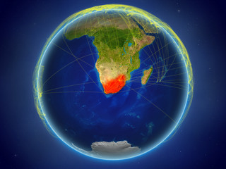 South Africa from space on planet Earth with digital network representing international communication, technology and travel.