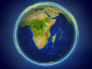 Malawi from space on planet Earth with digital network representing international communication, technology and travel.