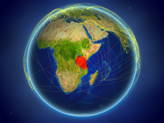 Tanzania from space on planet Earth with digital network representing international communication, technology and travel.