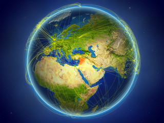 Syria from space on planet Earth with digital network representing international communication, technology and travel.