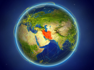 Iran from space on planet Earth with digital network representing international communication, technology and travel.