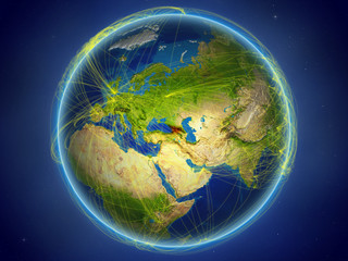Georgia from space on planet Earth with digital network representing international communication, technology and travel.