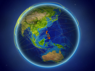 Philippines from space on planet Earth with digital network representing international communication, technology and travel.