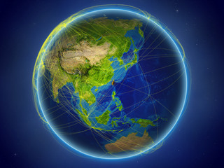 Taiwan from space on planet Earth with digital network representing international communication, technology and travel.