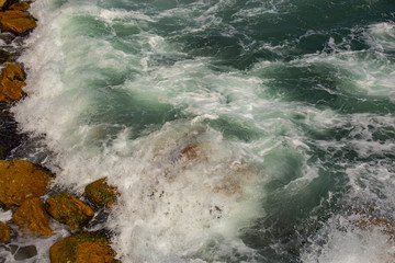 Waves during a storm. View from above. Red code. Rest on the Black Sea coast in Bulgaria. Elemental force.