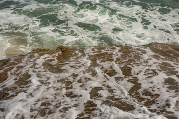 Waves during a storm. View from above. Red code. Rest on the Black Sea coast in Bulgaria. Elemental force.