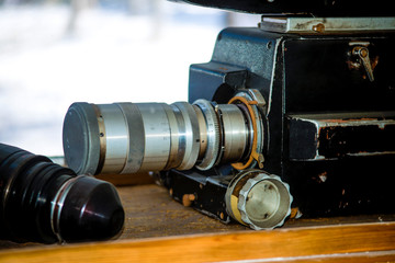 Old movie camera behind the window.