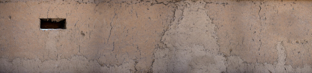 The texture of clay on the walls.