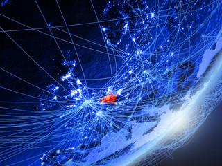 Belgium on green model of planet Earth with network at night. Concept of blue digital technology, communication and travel.