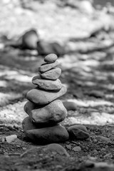 Black and white images of stone cairn made from river rocks from the Naches River near Boulder Cave in Washington State.