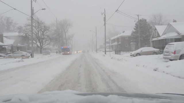 TORONTO, CANADA on Dec 16th: Driving on O'Connor Blvd on December 16th, 2016 in Toronto, Canada. A sudden snowstorm hit Toronto in the afternoon bringing approx 12 cms of snow.