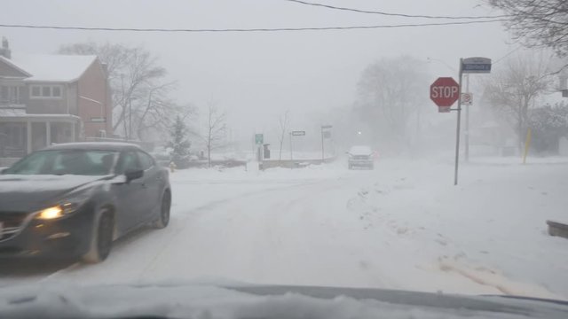 TORONTO, CANADA on Dec 16th: Driving in a snowstorm on December 16th, 2016 in Toronto, Canada. A sudden snowstorm hit Toronto in the afternoon bringing approx 12 cms of snow.