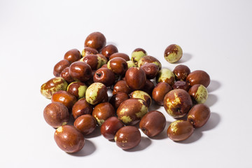 Jujube fruits close up on white.