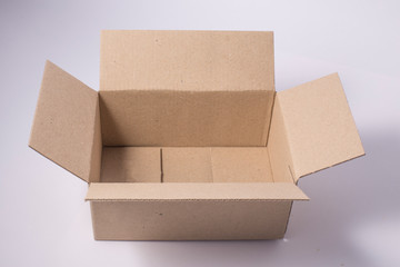 Open cardboard package box isolated.