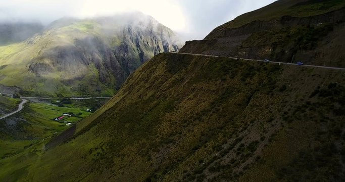 Aerial view of foggy road in the middle of jungle