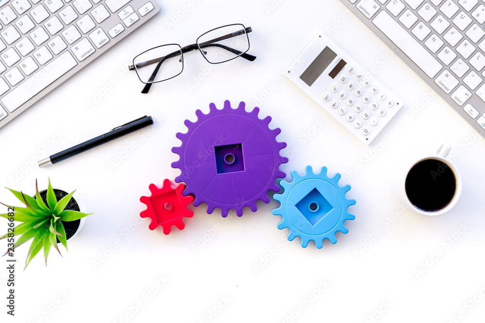 Aufkleber teamwork in business concept. toy gears on white office desk with computer keyboard top view copy sp