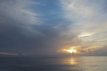 Sailing Across the Atlantic Ocean with a magnificent view of the Sunrise between the fluffy clouds