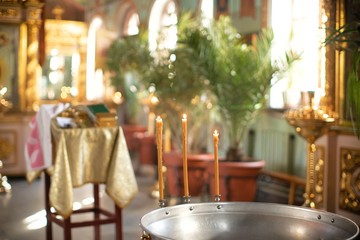church candles burn in prayer