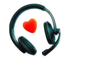 Black and Green Headset, Headphones with Microphone and Red Heart Isolated On White Background.  Call Center, Technical Support, Love, Valentines Day, Medicine, Music Concept.