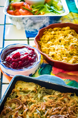 Green Bean Casserole, Stuffing, Cranberry Sauce, and Salad at a Thanksgiving Dinner