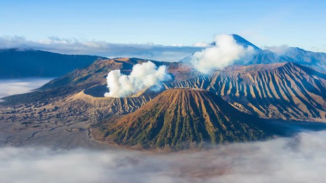 Beautiful Volcano and Misty floating Around Hillside , Landmarks Nature Travel Place Of Indonesia 4K Time Lapse (zoom out)