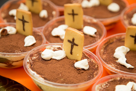 horizontal image with detail of chocolate sweets with cookies prepared for halloween party