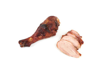roast turkey leg and sliced turkey meat isolated on white background.
