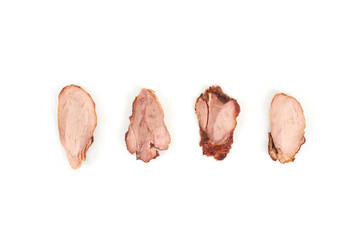 Slices of grilled chicken meat, isolated on white background.