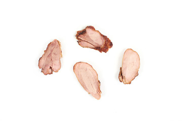 Slices of grilled turkey meat, isolated on white background.