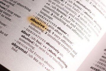 Obraz premium The word or phrase Abusive in a dictionary.
