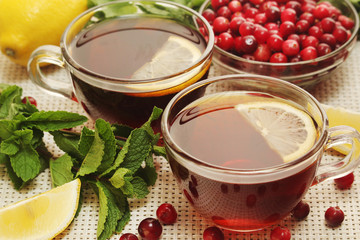 Hot tea with lemons, mint and cranberry	