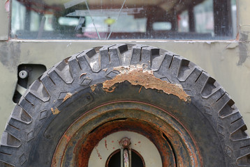 Close-up spare tires on back old car dirty with mud.