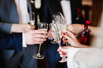 Gorgeous wedding couple enjoys champagne in the ceremony