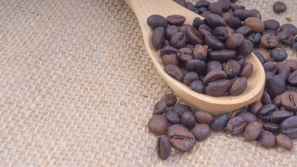 Fototapeta premium Coffee beans closeup with selective focus and crop fragment