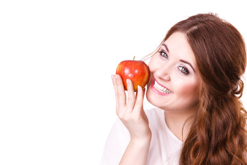 Woman holds apple fruit close to face, isolated