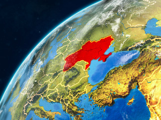 Ukraine on realistic model of planet Earth with country borders and very detailed planet surface and clouds.