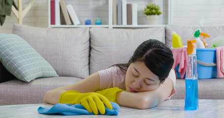 Tired asian woman asleep on marble table