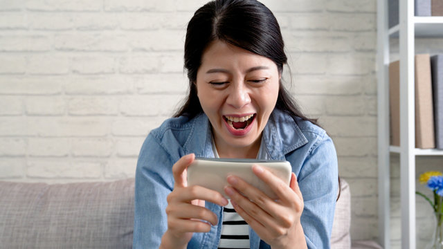 Cheerful Woman Laughing Watching Football Game