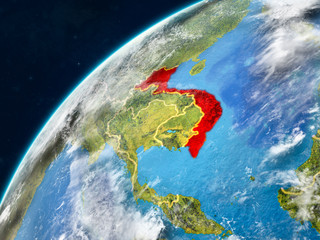 Vietnam on realistic model of planet Earth with country borders and very detailed planet surface and clouds.