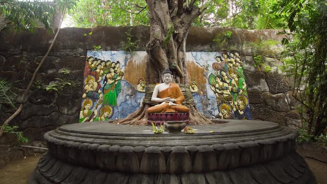 Statue of the Buddhist God Buddha in the Buddhist temple Brahma Vihara Arama with statues of the gods on Bali island, Indonesia. Bali Architecture, Ancient design. Travel concept.