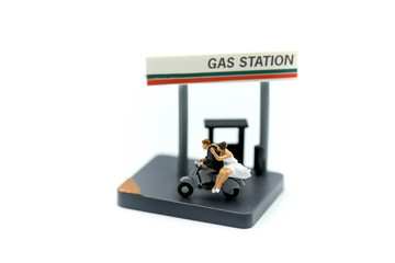 Miniature people : Couple of love Motorcyclists Motorcycle  On Gas Station,honey moon trip.