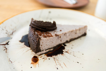 Cheesecake with chocolate biscuits and chocolate topping