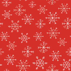 seamless pattern with white snowflakes on a red background
