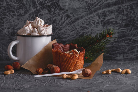 Delicious dessert. A sweet cake and a cup of cocoa on a gray texture background.  Holiday delicious breakfast. 